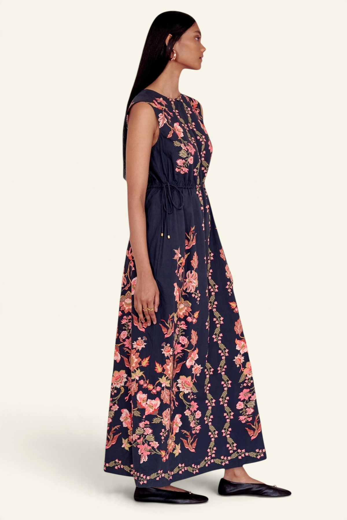 Banjanan Rhonda column dress in jet black with floral and bird print, featuring a crewneck and side-seam pockets.