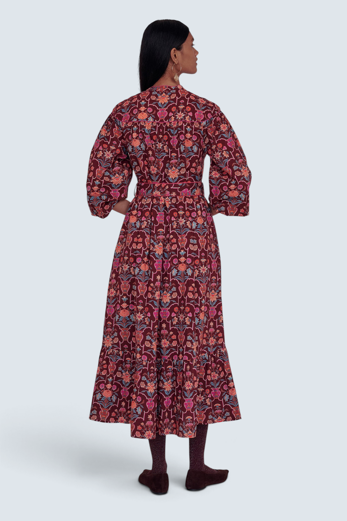 Banjanan Victoria dress in chestnut floral vase print with quilted shoulders and tassel waist tie, back view