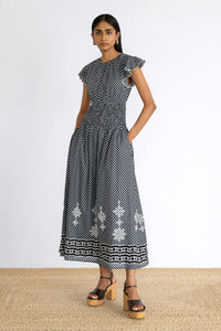 Front view of model posing wearing Aurelia Dress in Victorian Gingham Midnight print.