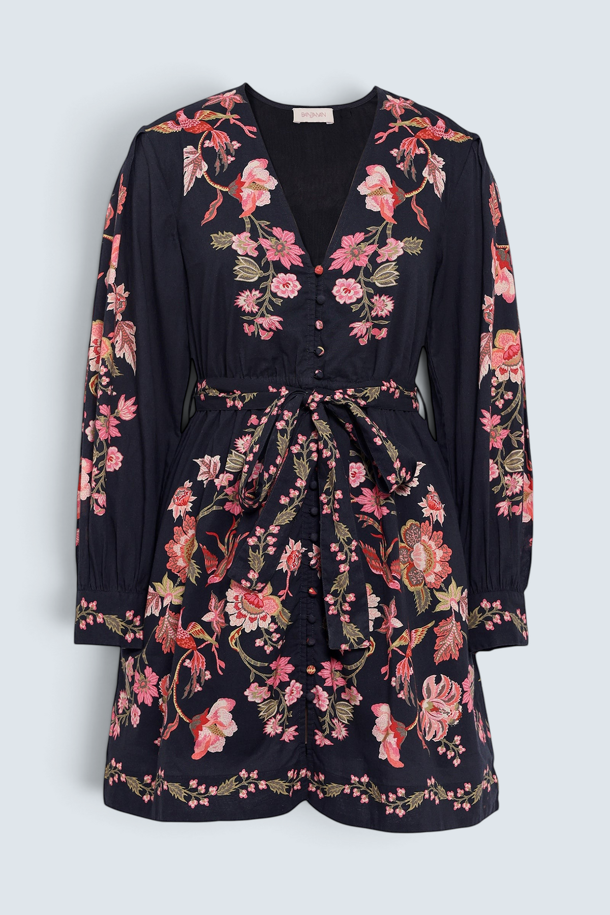 Banjanan Anne mini dress in black cotton voile with pink and green floral chintz print, long sleeves, and fabric belt