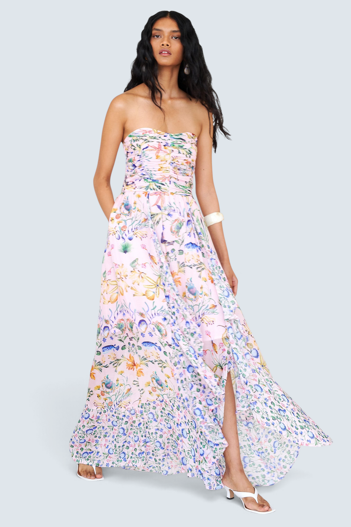 Banjanan Bella dress in Tidepool Conch print featuring a ruched bodice, cascading skirt, and sea-life motifs.