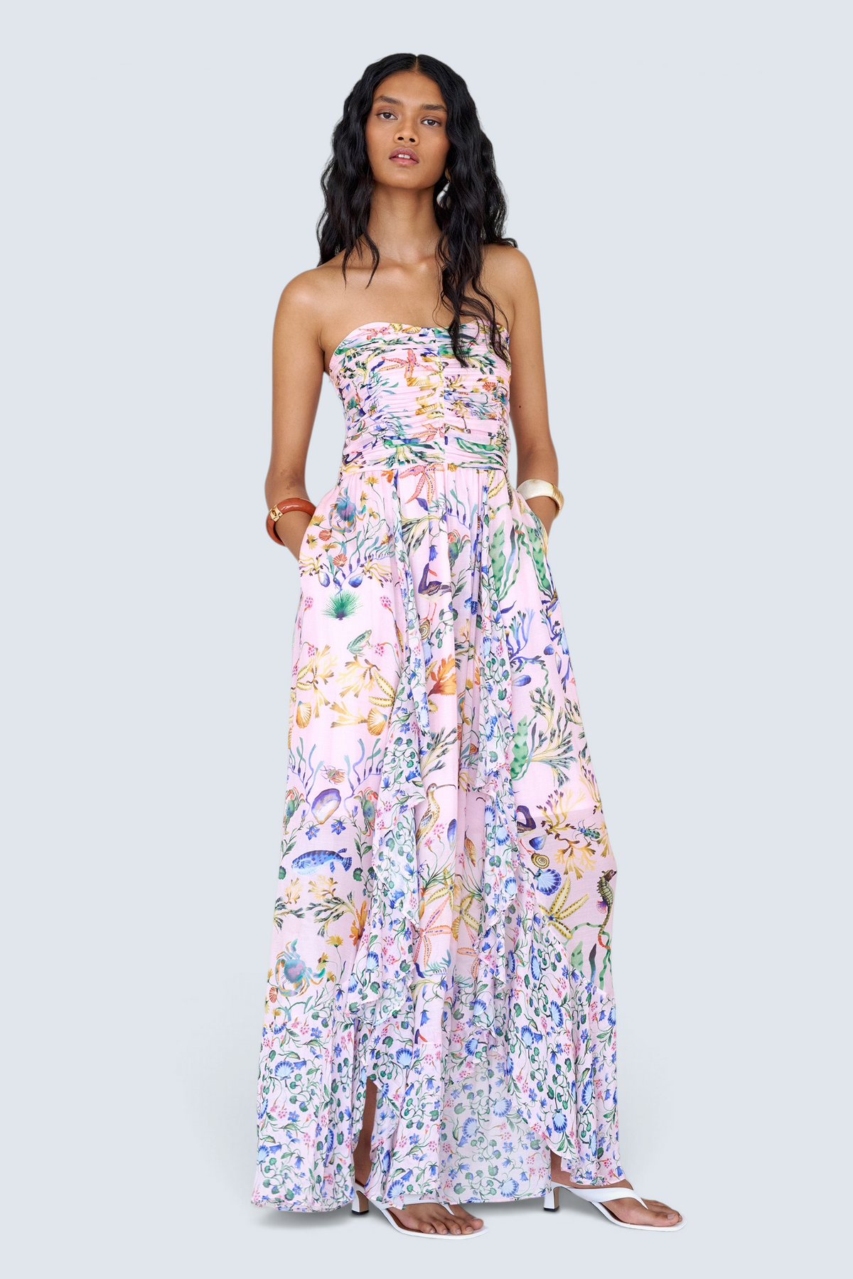 Banjanan Bella dress in pink Tidepool print with ruched bodice, cascading skirt, and conch shell detail.