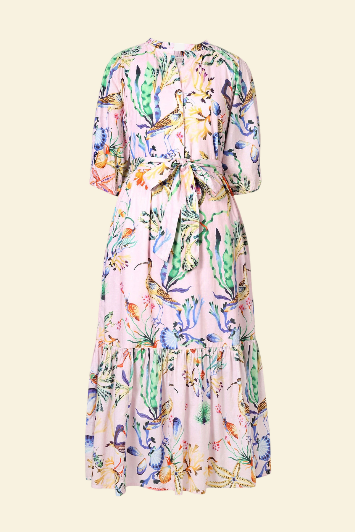 Banjanan Betty dress in pink cotton voile with Tidepool shell and sea life print, featuring a tie waist and pockets.