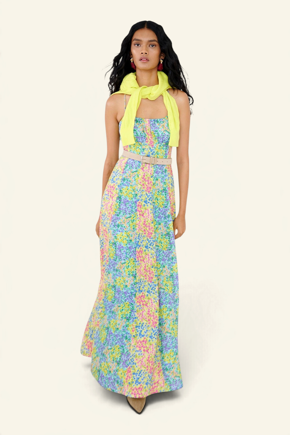 Banjanan Davina floral maxi dress in Harebell, Limpet, and Buttercup colors with a yellow sweater and beige belt.