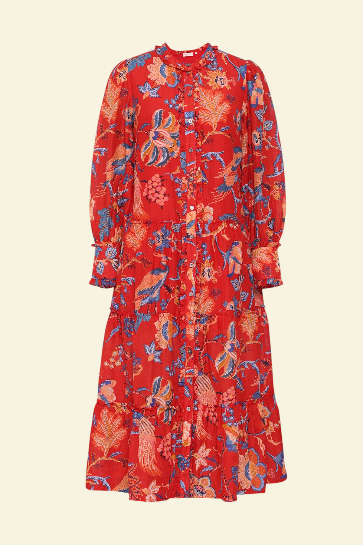 Front view of the Emira dress in Chintz print. It  features a flowing skirt, delicate ruffles, fabric-covered buttons, and a detachable belt.