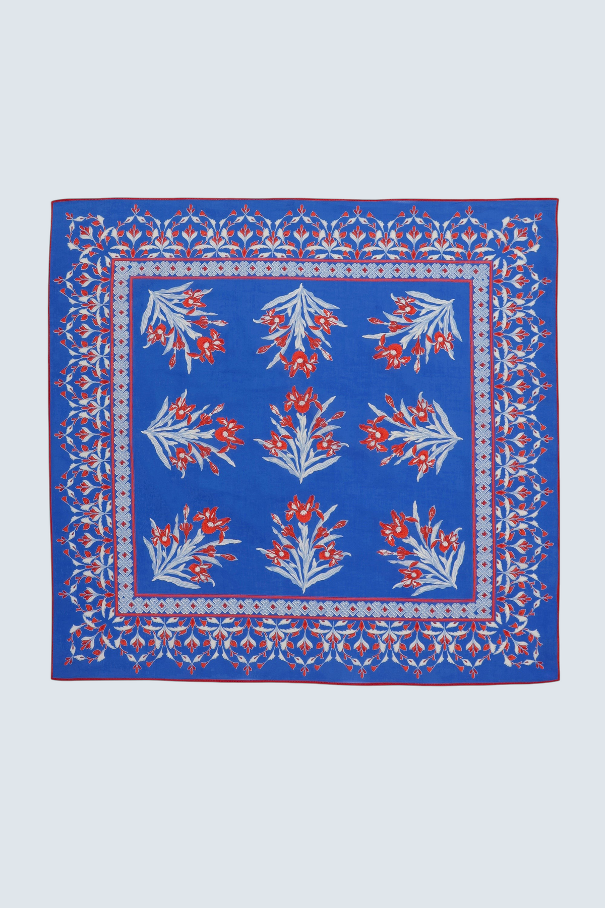 Flat lay of Frances scarf in featuring hand block printed Brigitte print with iris flowers.