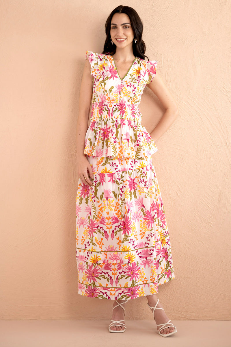 A full front view of model wearing Gayle skirt in Hydra garland print paired with Kira top in same print.