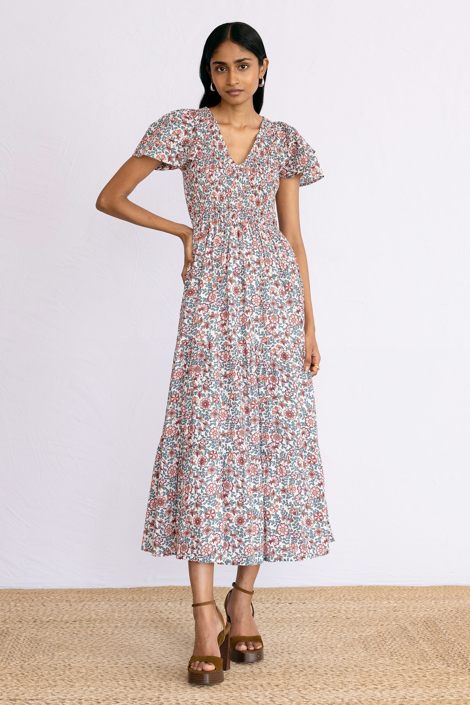 Front view of model wearing a calf length Ira Dress in Java Wine print.