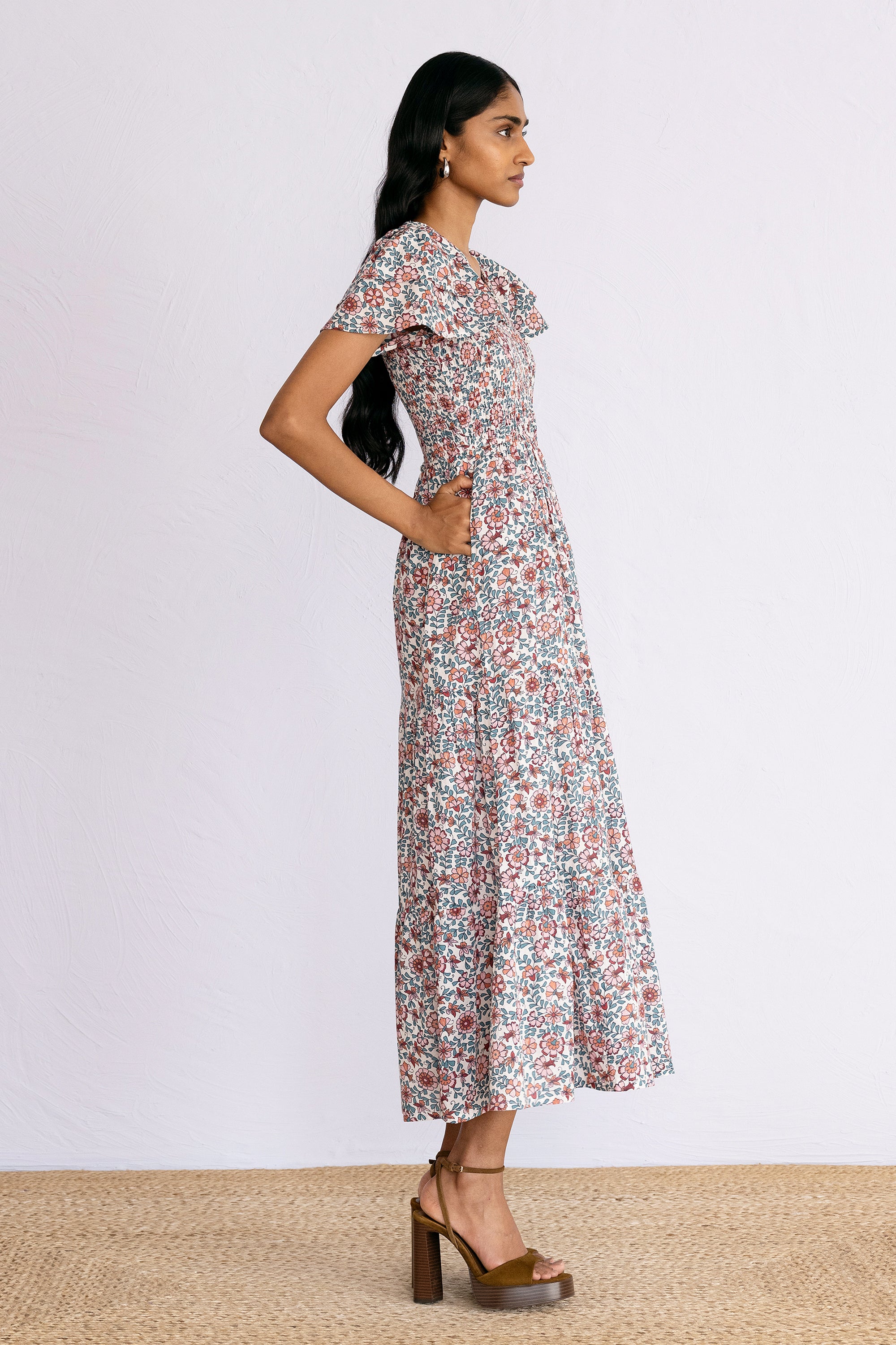 Side view of model wearing a calf length Ira Dress in Java Wine print.