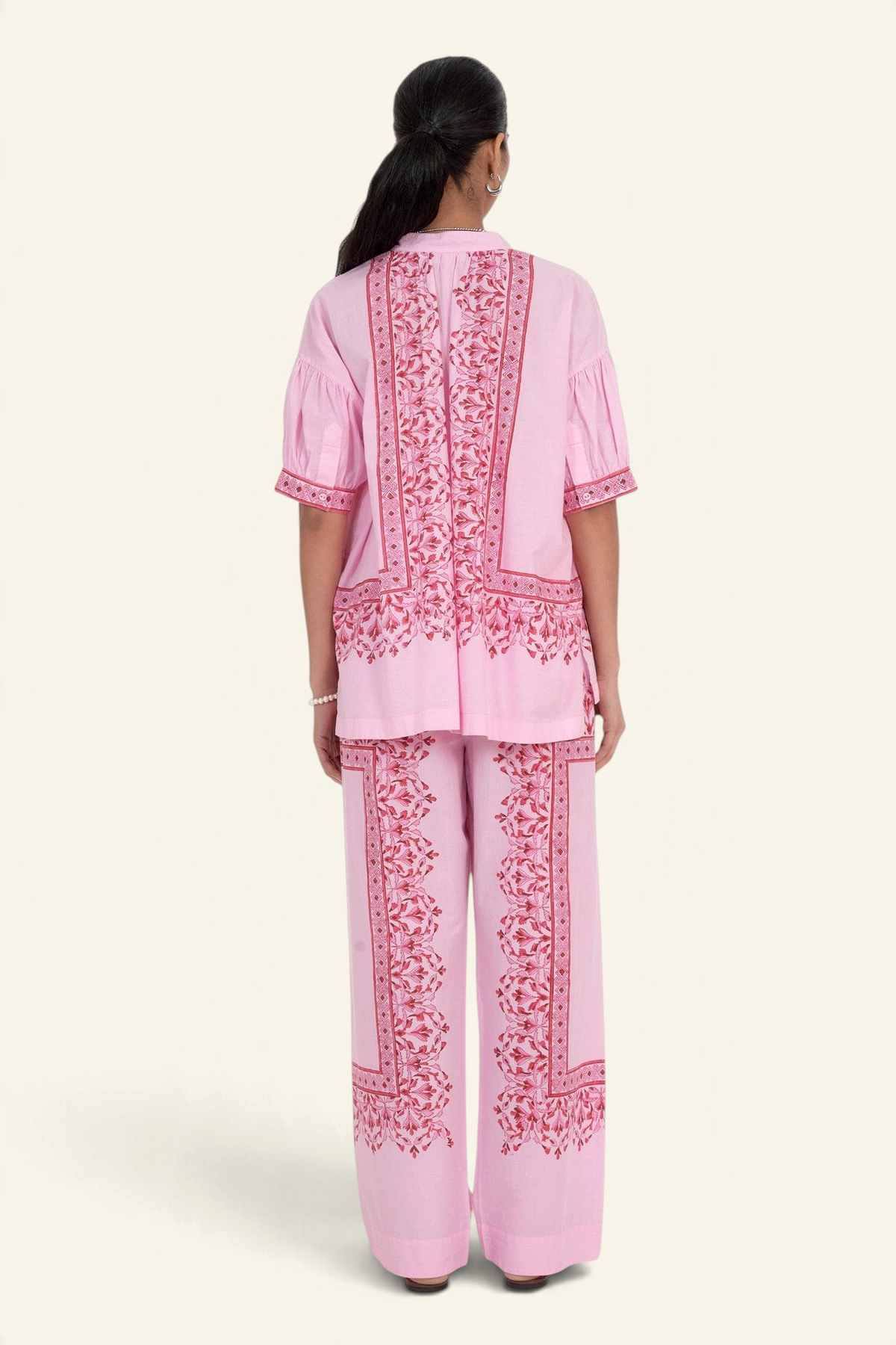 Banjanan Ivan pant in Brigitte Bonbon pink with hand-blocked geometric floral print and matching short-sleeve top.