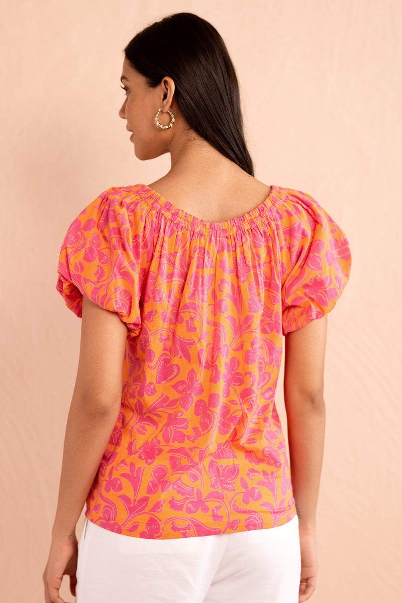 Back view close up of model wearing Louise Top in Gaia Nectarine print.
