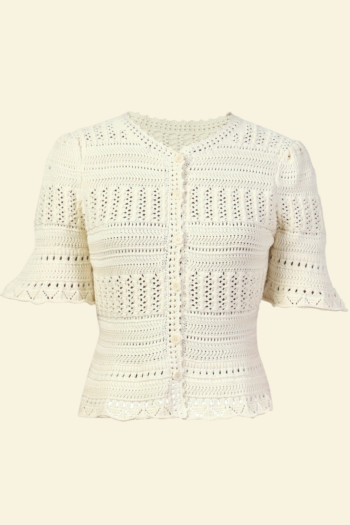 Banjanan ivory short sleeve cardigan in 100% cotton with intricate hand-crocheted trim and front button placket.