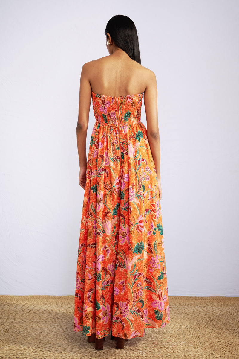 Back view of model wearing strapless maxi Madison Dress in Bali Floral Sunset print.