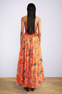 Back view of model wearing strapless maxi Madison Dress in Bali Floral Sunset print.