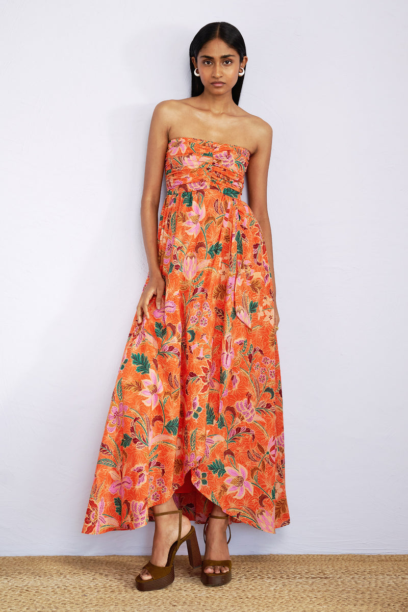 Front view of model wearing strapless maxi Madison Dress in Bali Floral Sunset print.