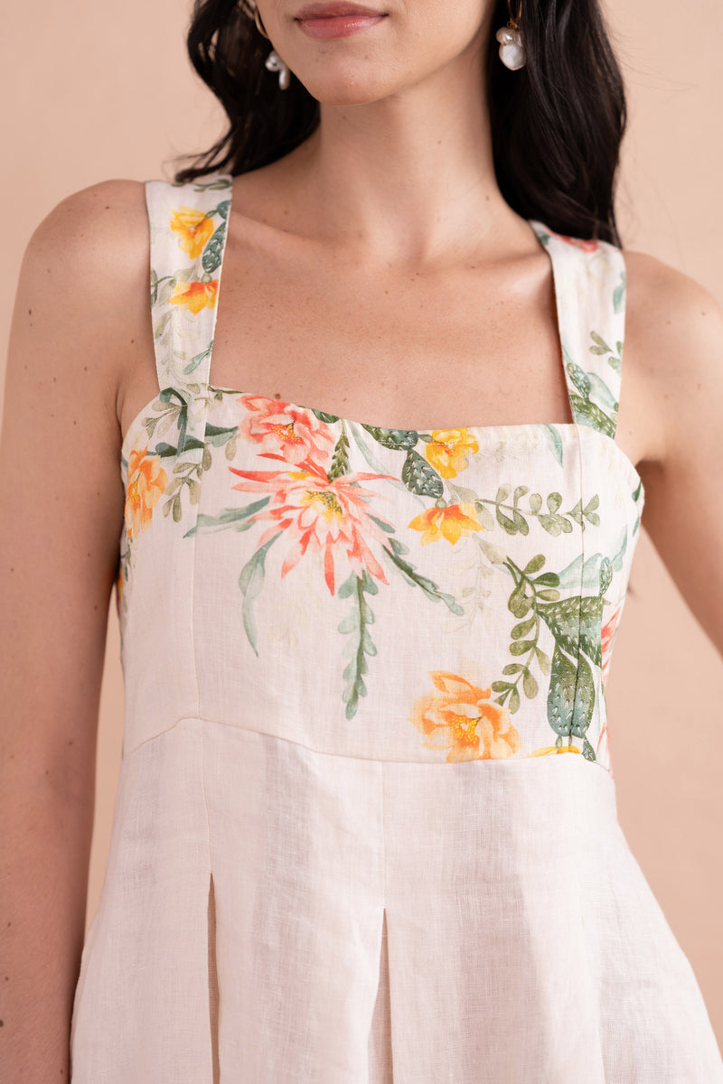 Front view close up of model wearing Ophelia Dress in Desert Rose Dawn print in linen.
