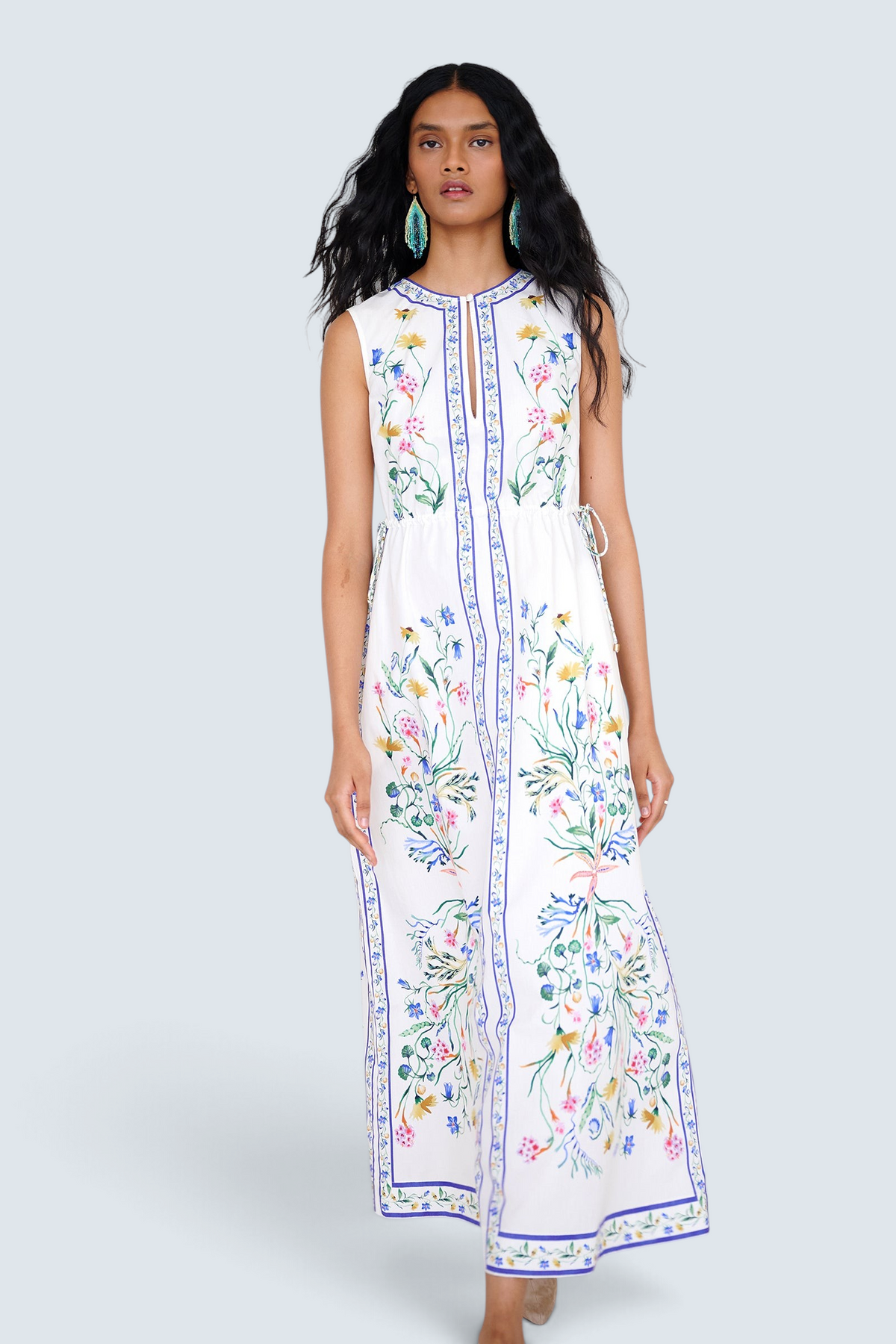 Banjanan Rhonda column dress in white with Tidepool floral print, keyhole neckline, and side drawstring details.