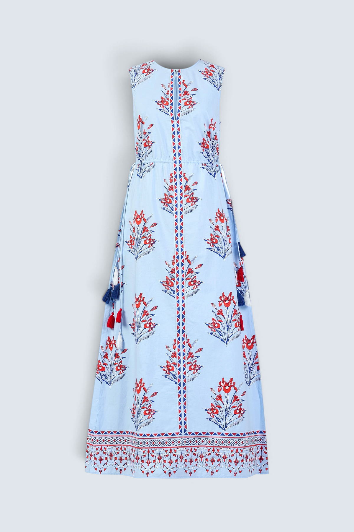 Front view of the Rhonda dress in the Brigitte print, featuring a sleek column silhouette, side drawstring details with fringe accents, a keyhole neckline, and iris floral motifs.