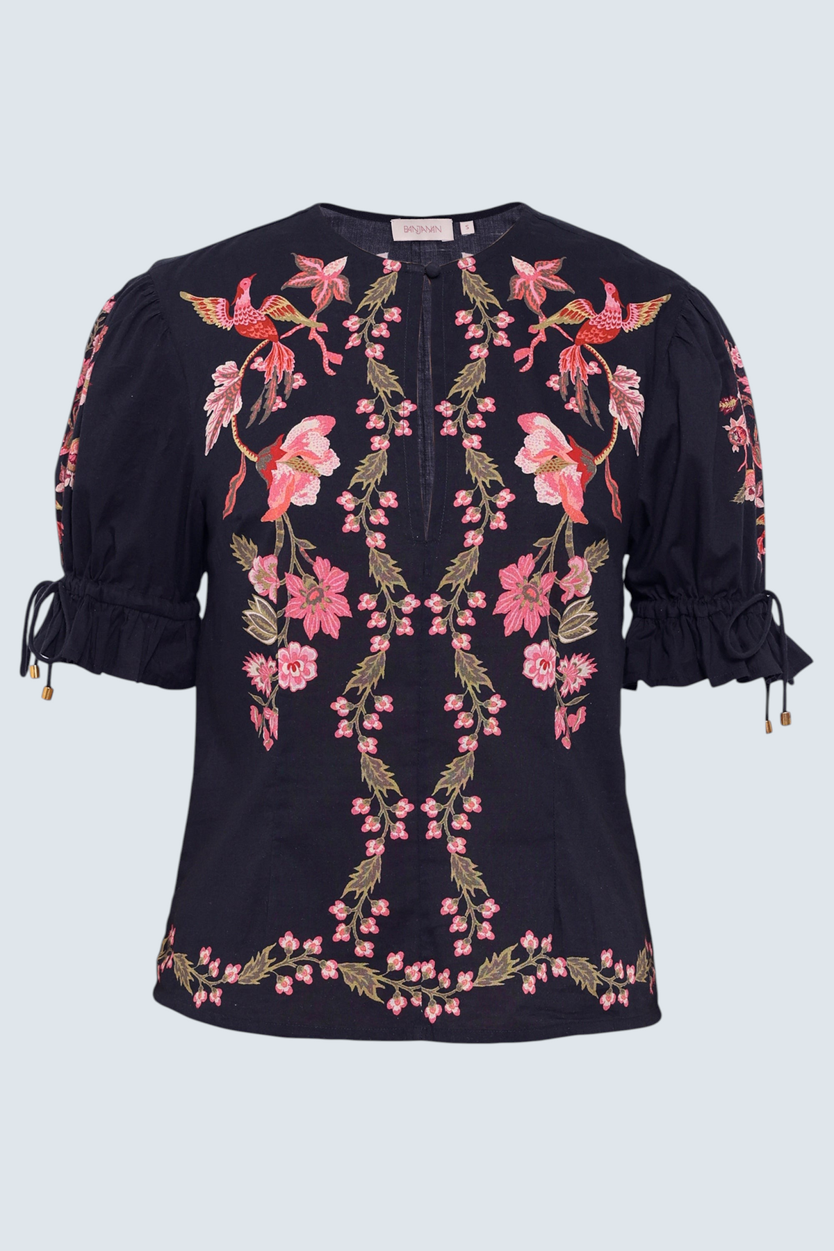 Front view of the Ricki top in Chintz print, featuring a crewneck with keyhole detail, adjustable drawstring sleeves, and vintage-inspired print placement.