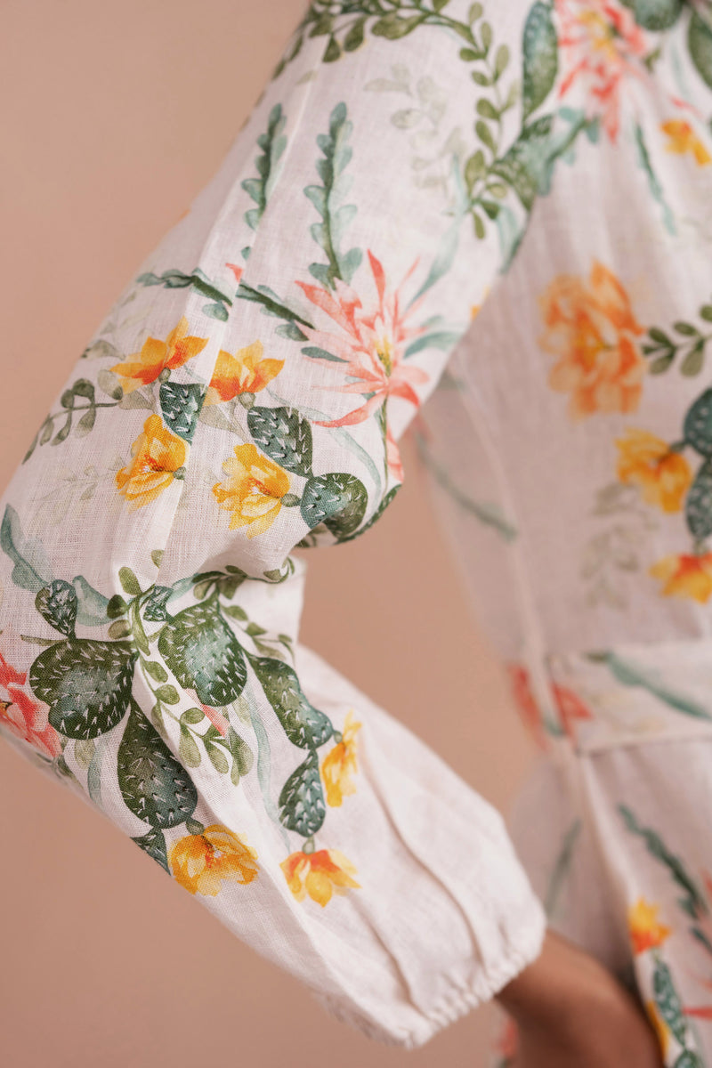 Sleeve details close up of woman wearing Rowena Dress in Desert Rose print.