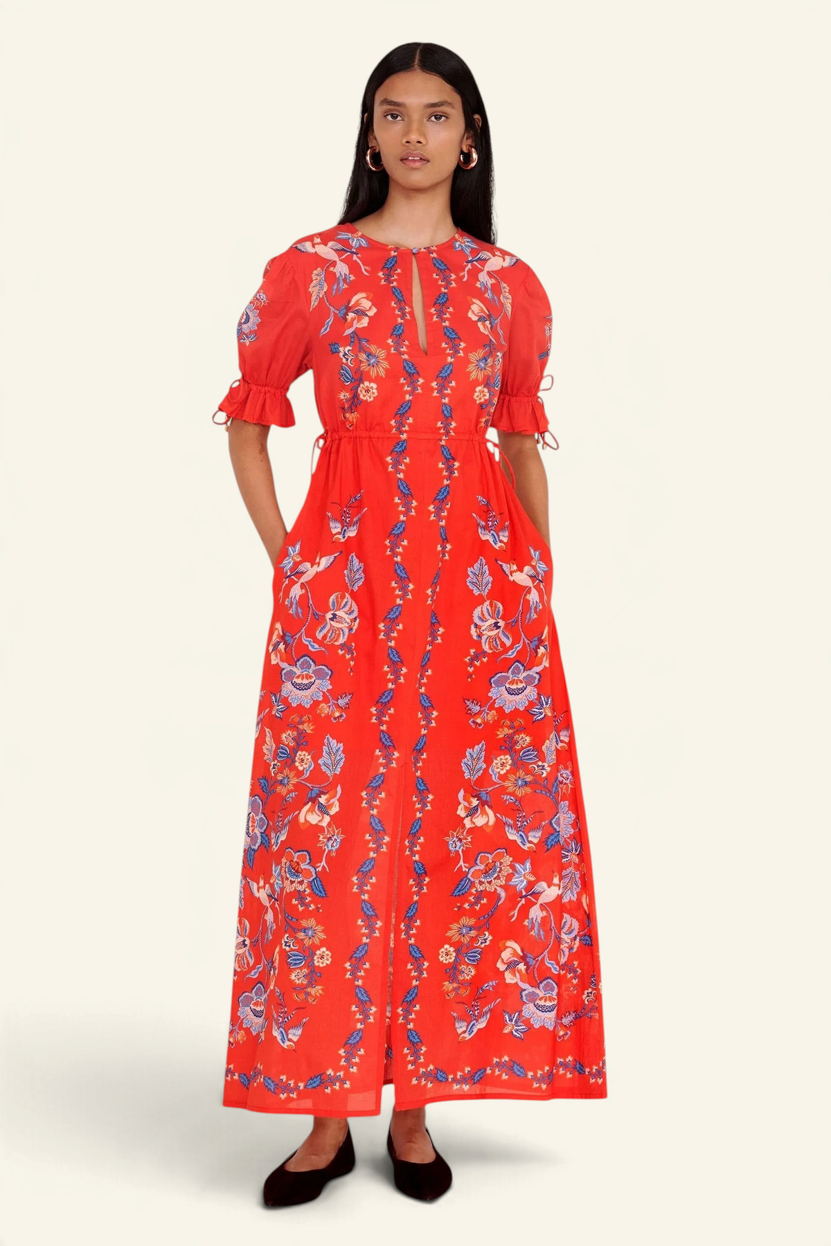 Banjanan Ruby dress in scarlet red with a vintage chintz bird and floral print, keyhole neck, and drawstring waist.
