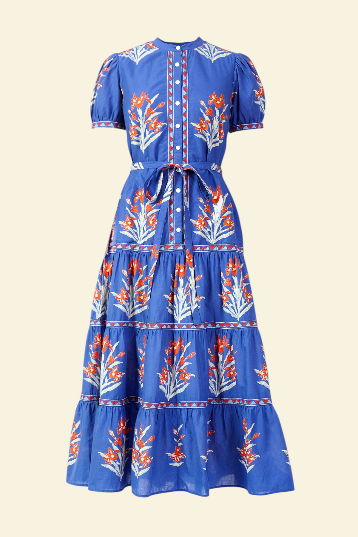 Front view of the Saylor dress in the Brigitte print, featuring a full-length shirtdress silhouette, tiered skirt, detachable belt, and hand-screen-printed iris floral motifs.