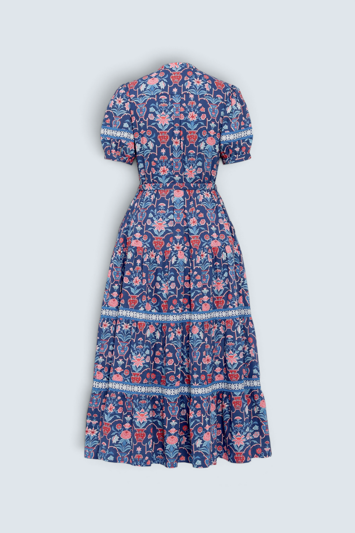 Banjanan Saylor full-length shirtdress in medieval blue floral vase print with lace trim and tiered skirt, back view.