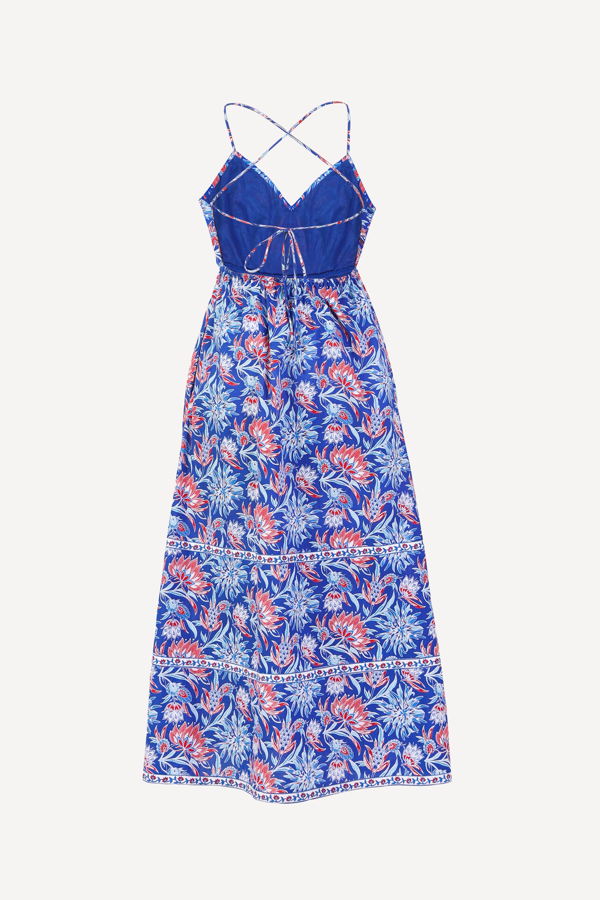 Back view of the Sofia strappy sundress in Philippa floral print with open back, criss-cross tie, gathered ankle-length skirt, and side pockets.