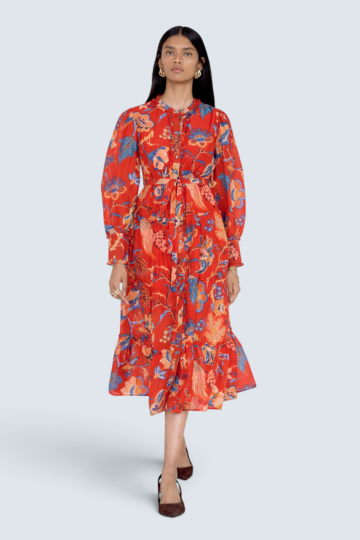 Banjanan Emira dress in carmine red cotton silk with Victorian-inspired chintz floral print, ruffles, and belt.