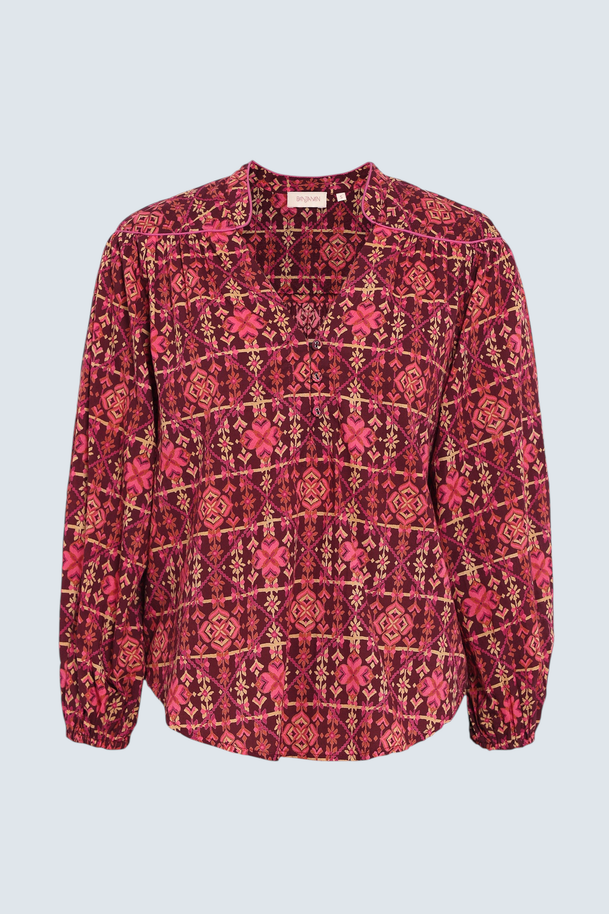 Banjanan Vanessa top in mahogany cotton voile with a geometric needlepoint floral print, v-neck, and quilted details.