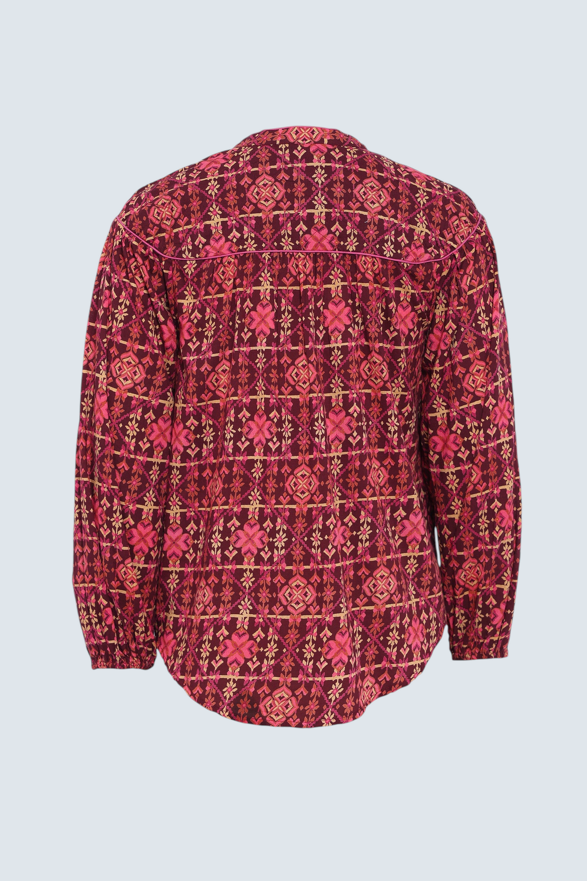 Banjanan Vanessa top in mahogany cotton voile with a geometric floral needlepoint print and quilted shoulder detail.
