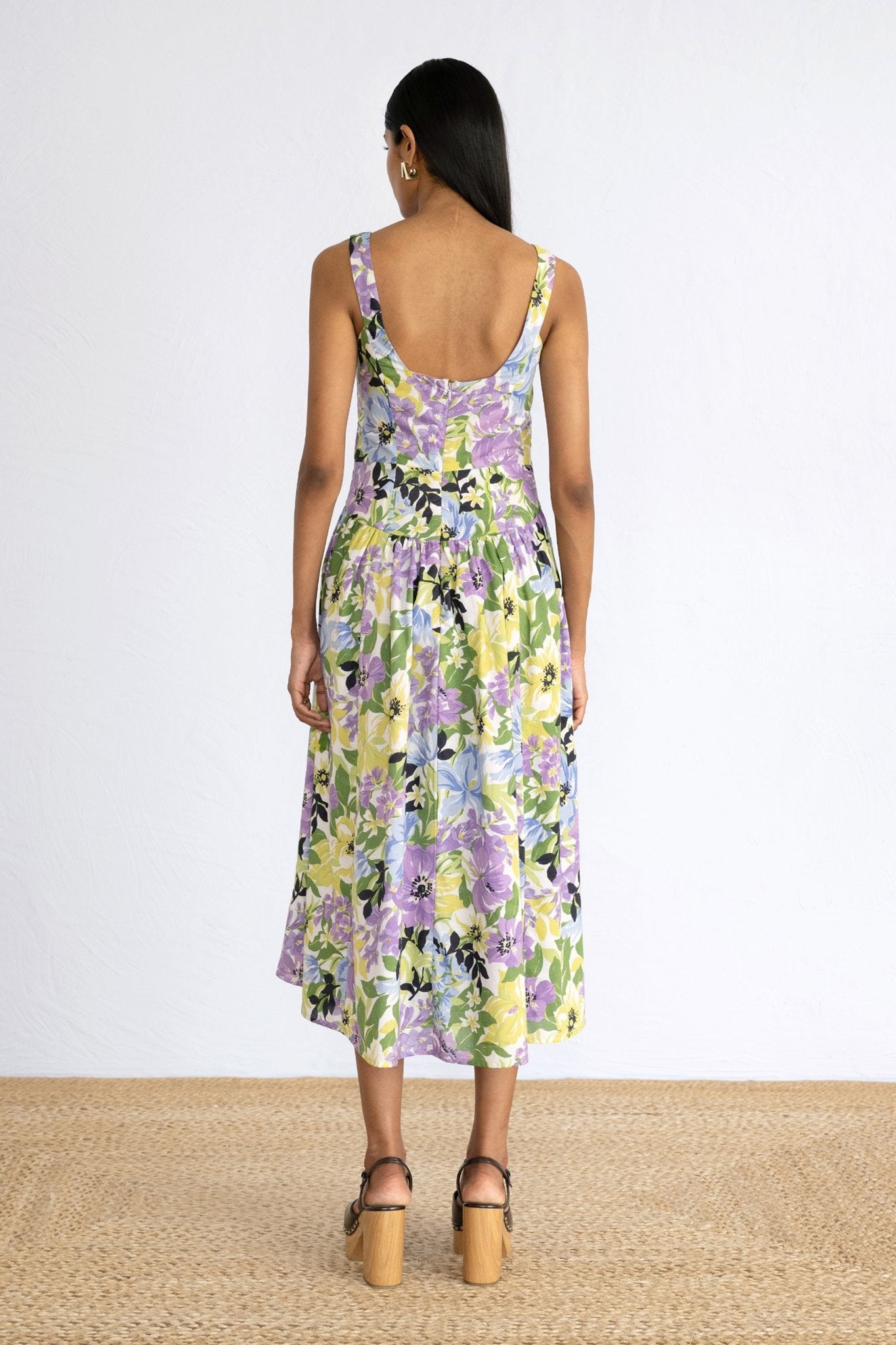 Back view of model standing wearing Aurora Dress in Bouquet Chive print. 