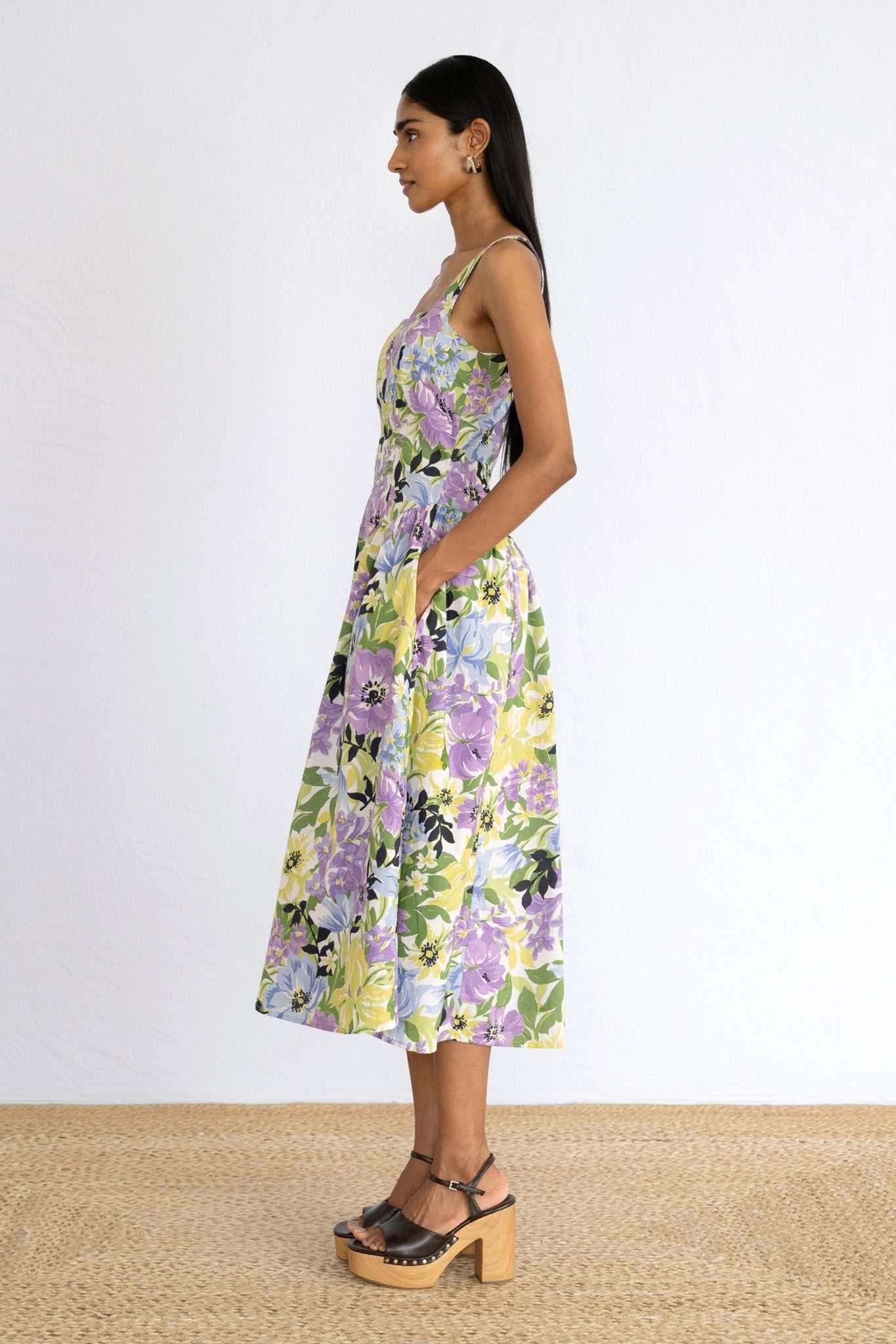 Side view of model standing wearing Aurora Dress in Bouquet Chive print. 