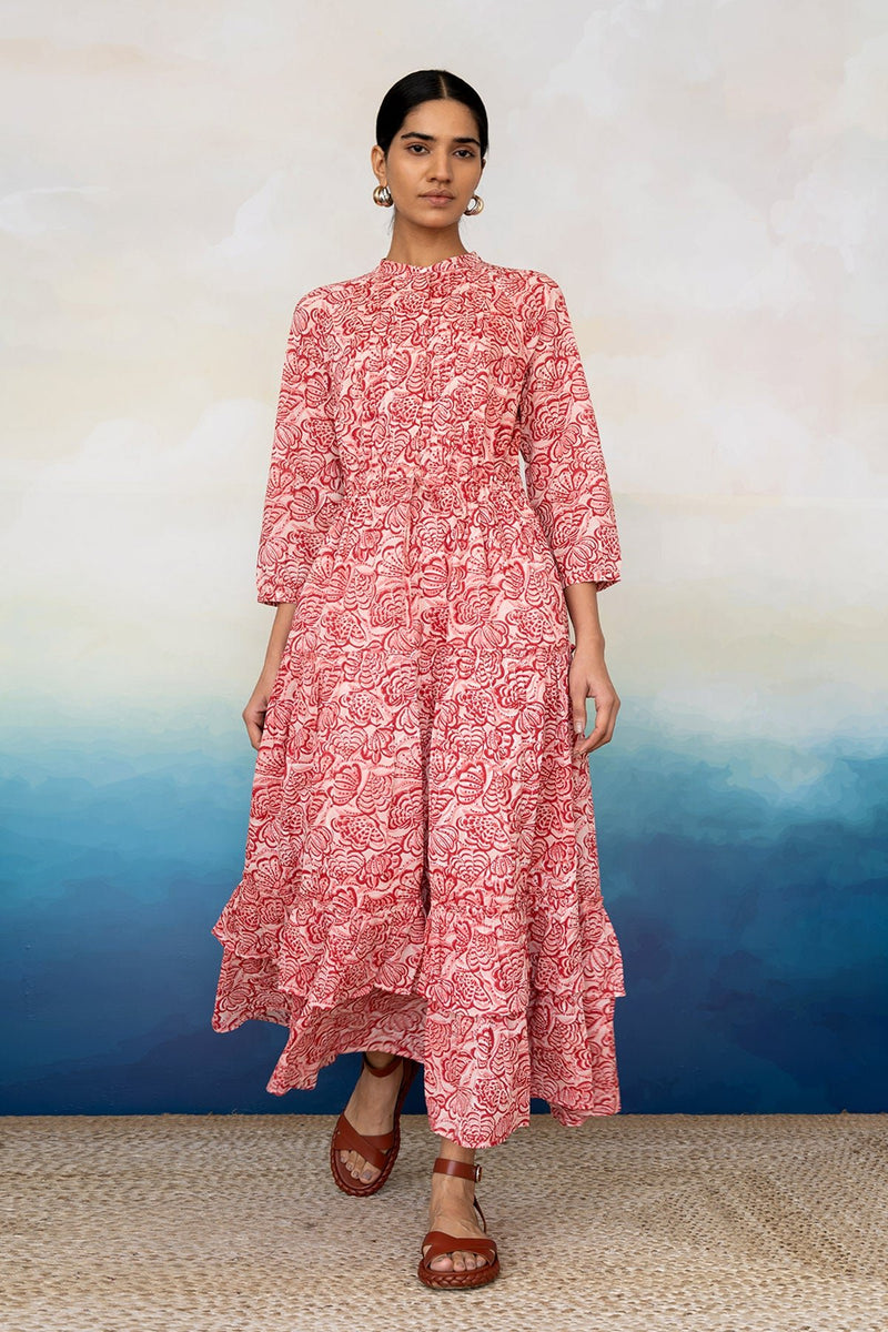 Front view of women wearing a full length Bazaar Dress Shell Coral