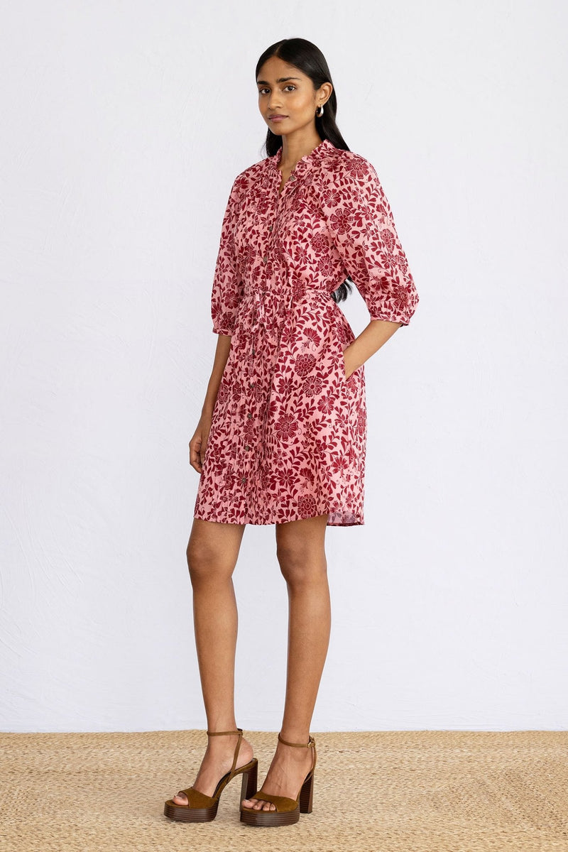 Side view of model standing wearing mini Benita Dress in Komodo Candy print.