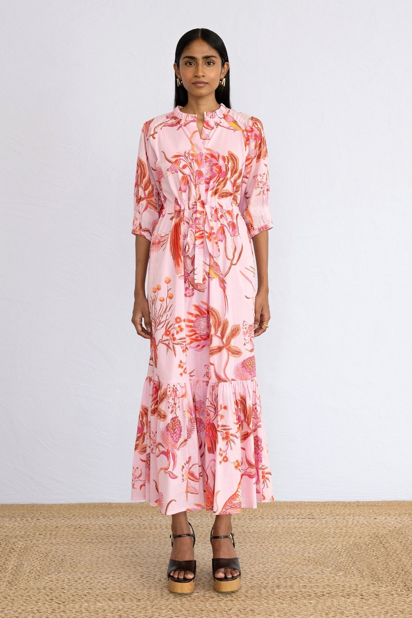 Front view of model standing wearing Betty Dress in Botany Bay Pink Mist print.