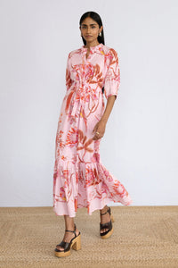 Model stepping sideways wearing Betty Dress in Botany Bay Pink Mist print.