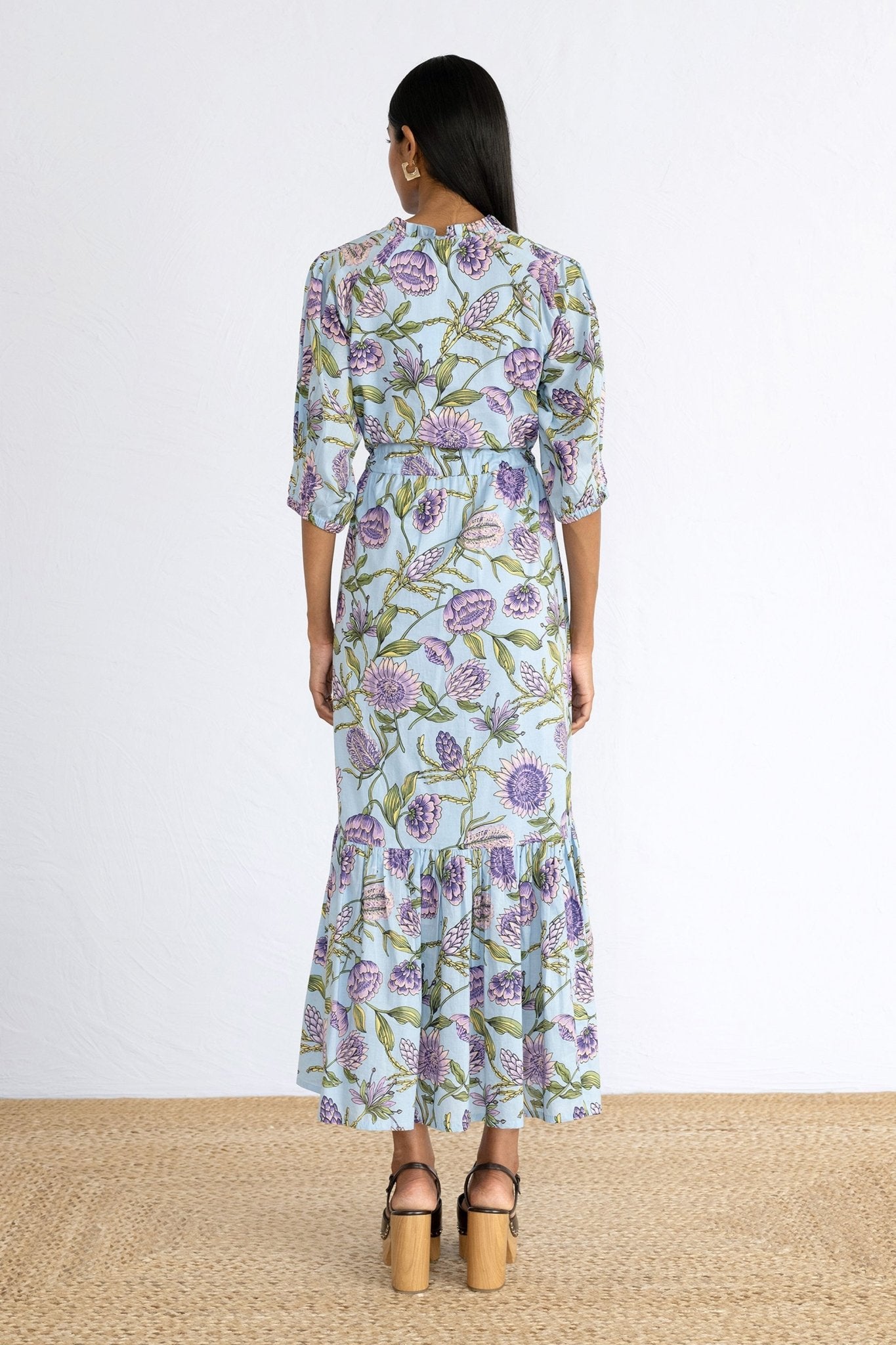 Back view of model wearing Betty Dress in Protea Orchid print. 