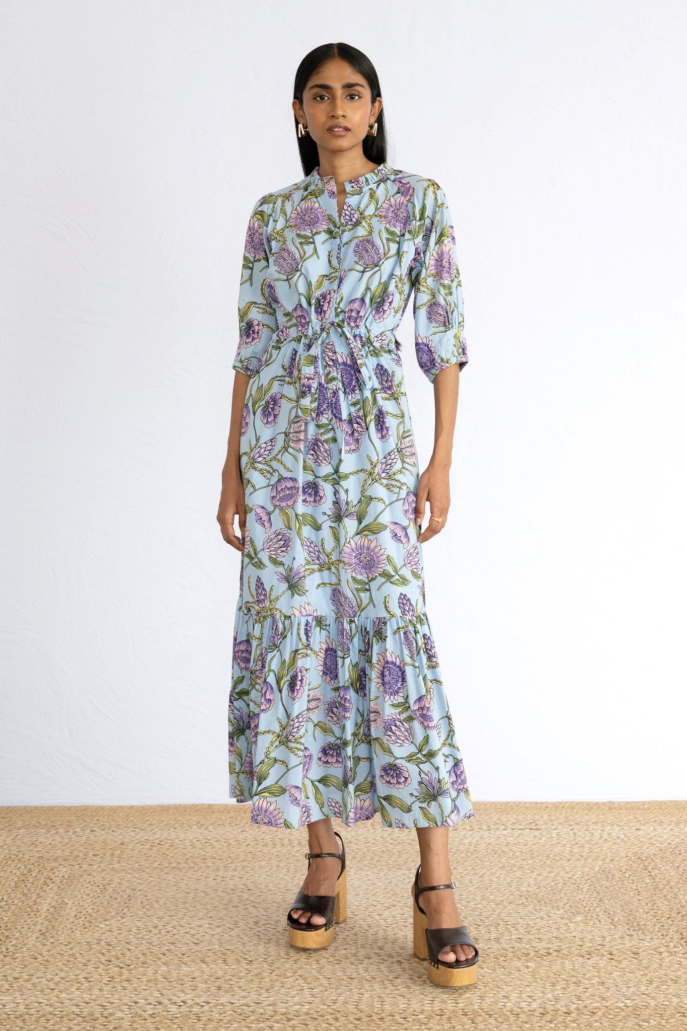 Front view of model wearing Betty Dress in Protea Orchid print. 