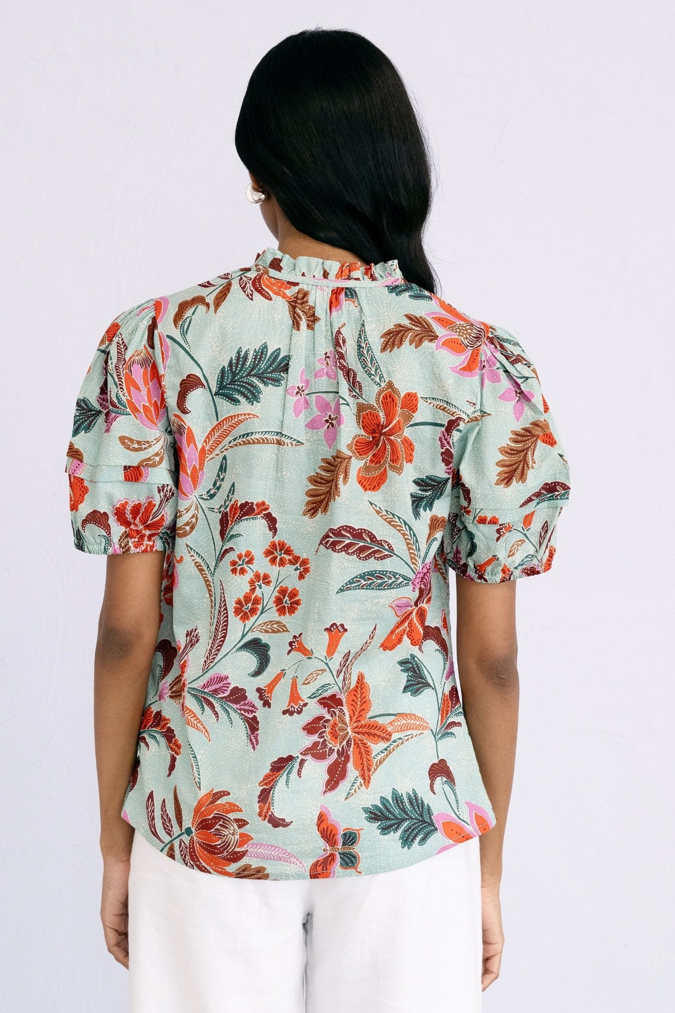 Back view of model wearing Bronte Top Bali Floral Haze.