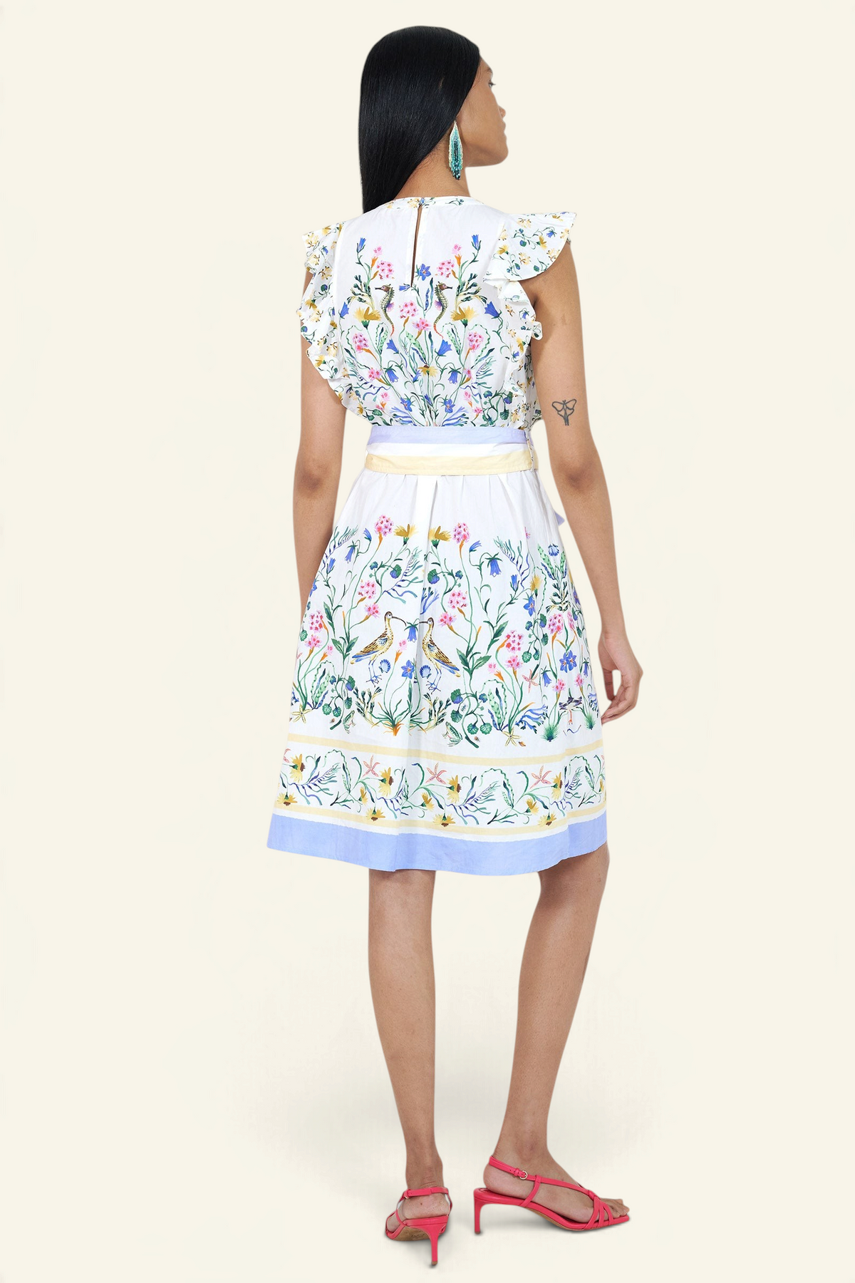 Banjanan Bulbul dress in Tidepool Grotto print with ruffled shoulders, self-belt, and keyhole back, back view.