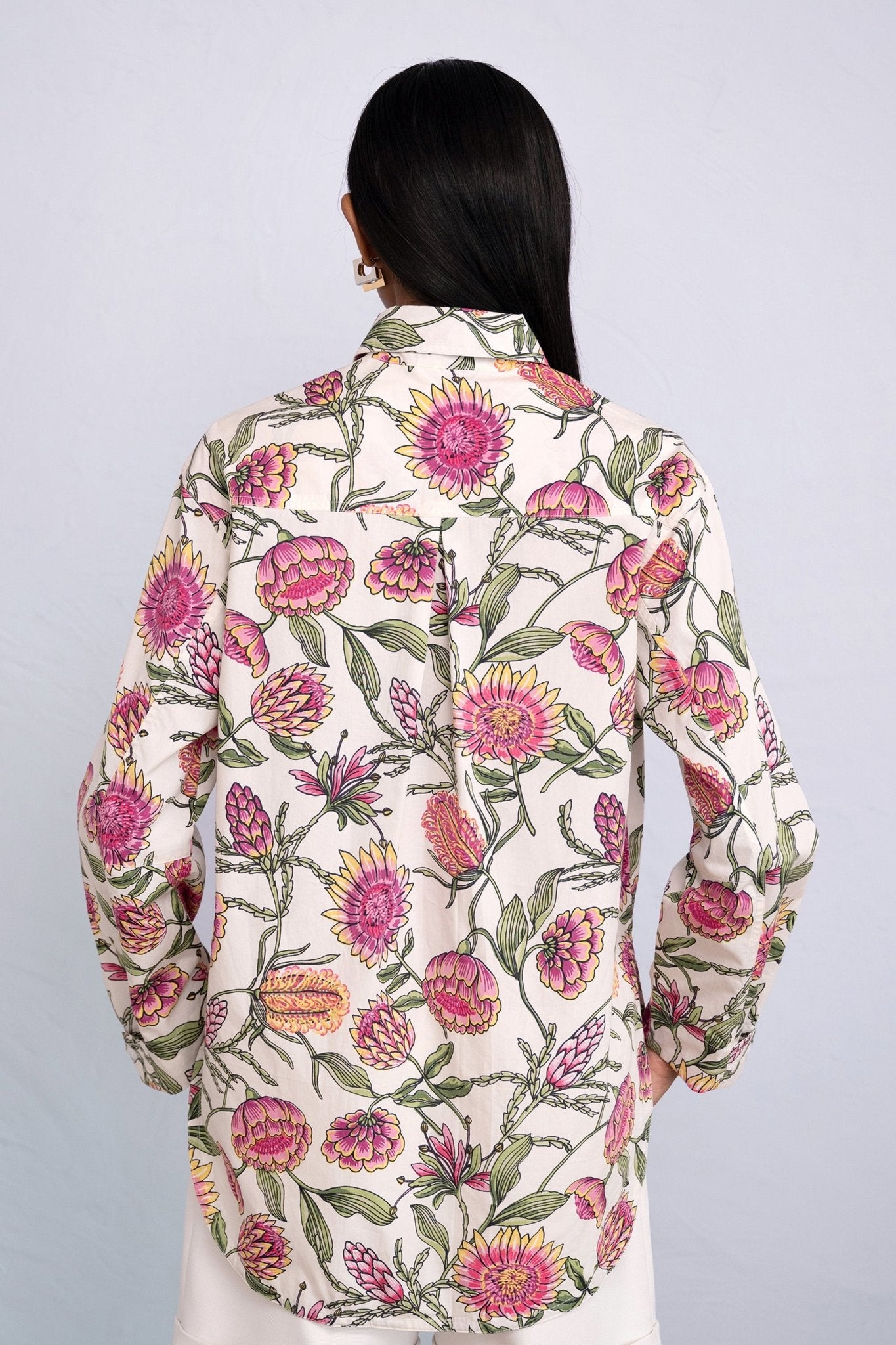 Back view close up of model wearing Charlotte Shirt in Protea Cypress print.
