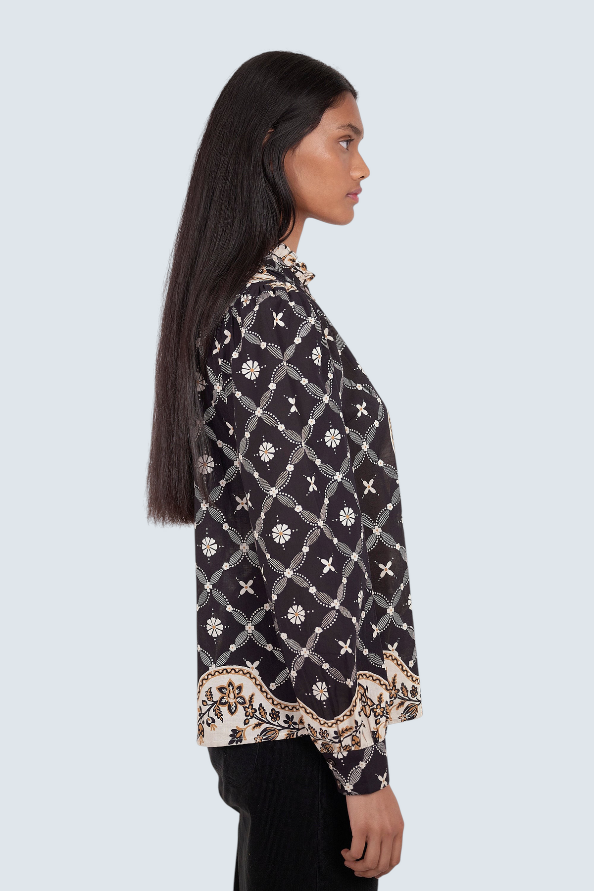 Banjanan Christina shirt in black with a white geometric bandana print, featuring a frilled collar and puffed sleeves.