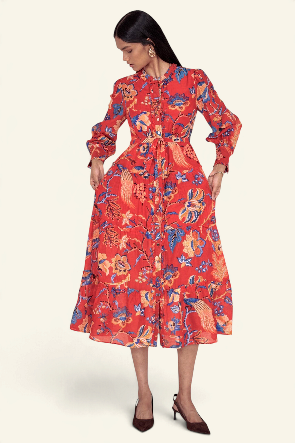 Banjanan Emira dress in carmine red cotton silk with Victorian-inspired floral chintz print, ruffles, and belt.