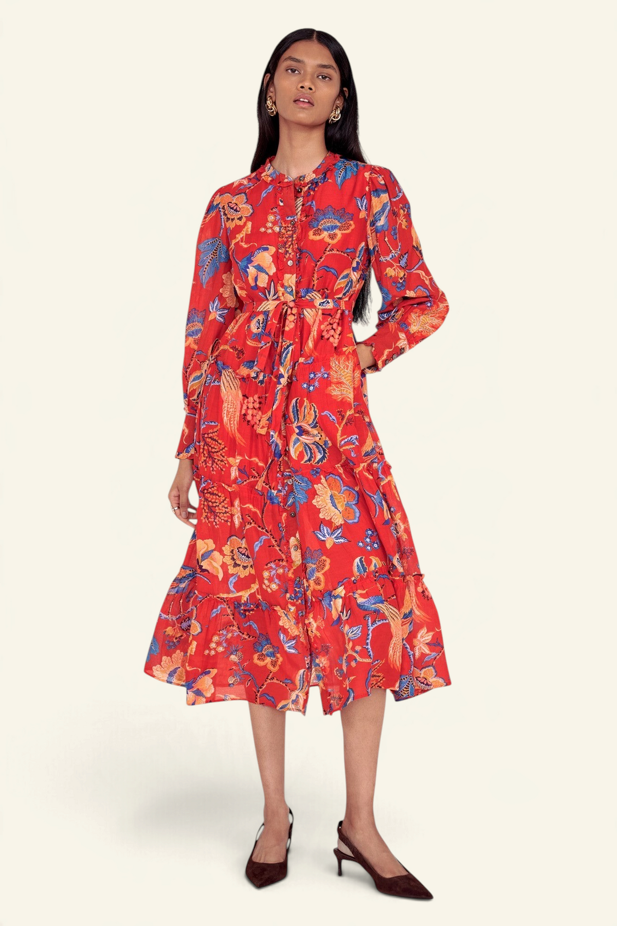 Banjanan Emira dress in carmine red cotton silk with a floral chintz print, ruffled skirt, and detachable belt.