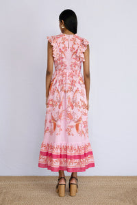 Back view of model standing straight wearing a full length Hannah Dress Botany Bay Pink Mist.