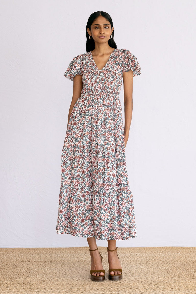 Front view of model wearing a calf length Ira Dress in Java Wine print.