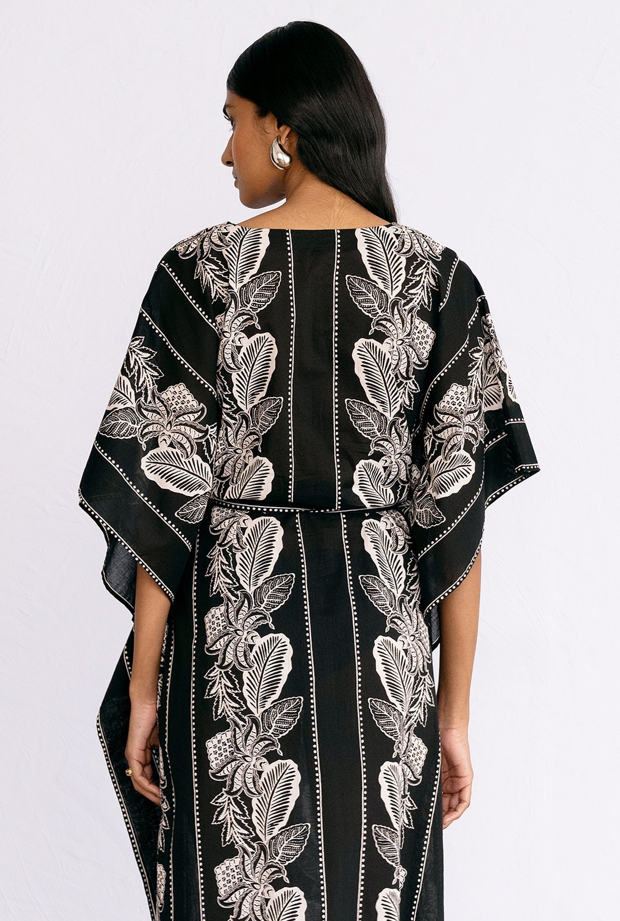 Back view close up of model wearing Jayden Kaftan Lombok Border Black.