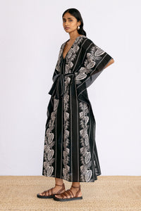 Side view of model wearing Jayden Kaftan Lombok Border Black.