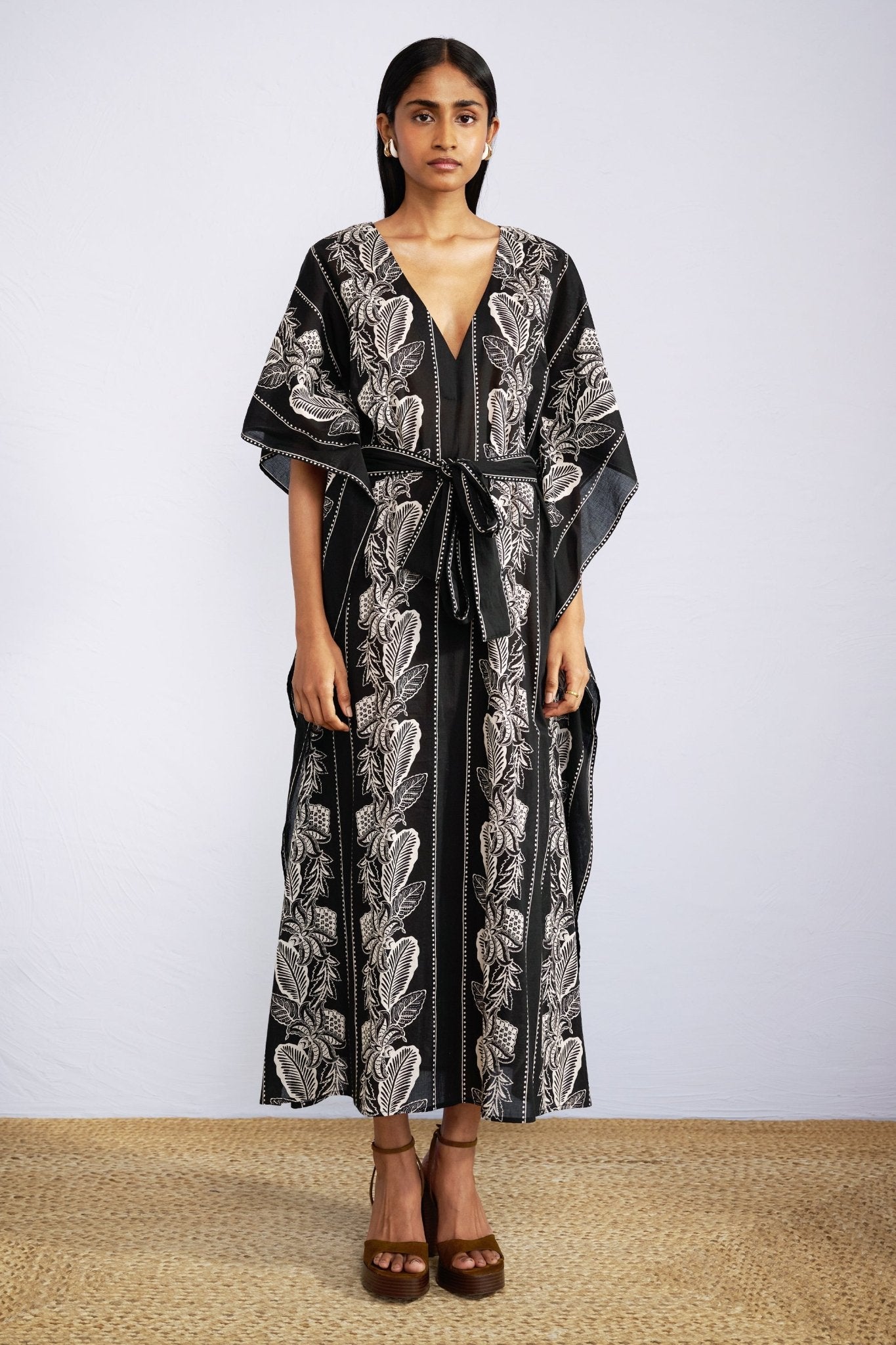 Front view of model wearing Jayden Kaftan Lombok Border Black.